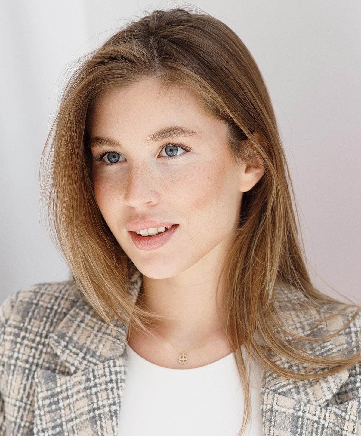 Young woman with long hair and blue eyes.